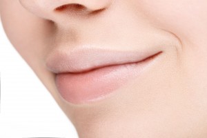 54571946 - part of face with beautiful full lips without makeup. close-up.